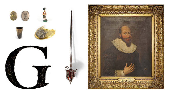 A large, printed capital letter G with a portrait in a gilded frame, a sword, cup, belt plates, gorget and a model Highlander soldier.