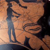 Image of the kylix showing a silhouette of an African slave depicted serving Greek guests