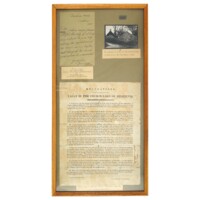 Regulations for the Mort house. A framed document titled Regulations for the management of the vault in the churchyard of Belhelvie. There is also a photograph of a low stone building next to a church in the frame, and the label Vault used to protect bodies from being removed by Resurrectionists. 