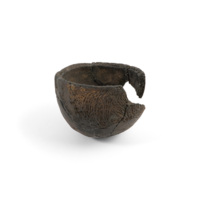 Pot. A small earthenware bowl with fragments missing. Curved dotted lines decorate the surface.