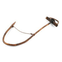Thraw cruik. A long hook shaped wooden rod, with a cord tied across the bend of the hook. There is a wooden handle with an loosely fitting hole and an iron disc allowing it to rotate.