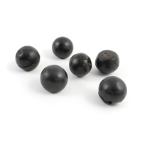 Pin heads. Six ball shaped black objects, smooth and glossy with some cracks, and holes on the bottoms, which are slightly flattened. They are about the size of a large marble.