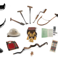 A large ornate printed capital letter T with tartan samples, a walking stick, thatching tools, a pair of shoes, a bonnet, a helmet and some archaeological objects.