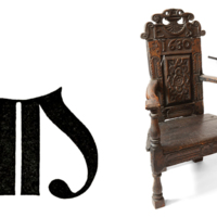 A large printed capital letter M, a wooden chair and a pistol.