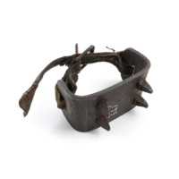 Log gripper. A wide, flat U shaped piece of iron with spikes on the underside and a leather strap over the top.