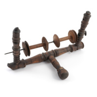 Sweir kitty. A wooden apparatus about a foot wide consisting of turned wooden rods. The base has two rods in a T shape, from the opposite ends of which project two more rods perpendicularly. Between these rods is a metal rod on to which is threaded two wooden spindles.