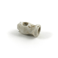 Bone toggle. A small toggle made of bone. One end has broken off.