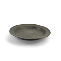 Communion plate. A wide pewter plate.