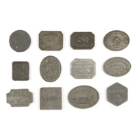 Communion tokens. Twelve small metal tokens in rectangular, circular, square, oval and hexagonal shapes bearing the names of parishes and dates from 1722 to 1865, with motifs such as churches and burning bushes, and mottos such as &quot;this do in remembrance of me&quot;, &quot;let a man examine himself&quot;, and &quot;lovest thou me&quot;.