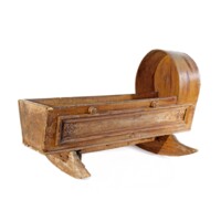 Cradle. Wooden cradle, with curved supports allowing it to rock.
