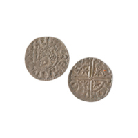 Penny. A small silver coin with a crude profile of a man wearing a crown on one side, and a cross and stars on the other.