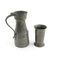 Communion vessels. A pewter jug inscribed 1/2 GALLn (half gallon) and a pewter beaker inscribed Assi Con Clola 1812.