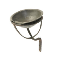 Christening bowl. A pewter bowl in a bracket allowing it to be held on a wall.