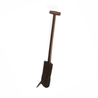Tuskar. A spade with a long, rounded rectangular iron blade and a wooden handle. The blade has a flattened spike or wing projecting from it perpendicularly on the end on one side.