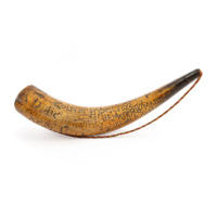 Touting horn. A large horn with a dull red, white and blue cord. The horn is inscribed with numerous names, initials and dates in different styles. Most prominent is the inscription CoLeNsT INDeL 1752, IA MeS BOWMAN 1752, inscribed with rope like writing. Other inscriptions include AD and W.V DF 1750. 