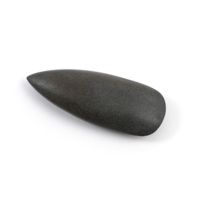 Axe head. A dark polished stone axe head about ten centimetres long, one end pointed and the other sharpened.