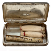 Image of early 20th century poison gas antidote in metal box.