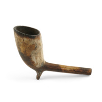 Pipe. Small clay tobacco pipe, stained yellow and brown.
