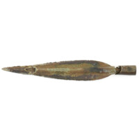 Spearhead. A large bronze socketed spearhead over a foot long. The blade is shaped like a long pointed leaf and is broken near the tip, revealing the socket which runs almost the length of the blade. The blade is also broken near the socket at the bottom, showing a length of wood inside.