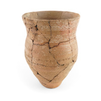 Ceramic beaker. A large pot which slightly flares out at the middle, before narrowing at the neck and flaring out toward the rim. It is decorated with dotted vertical and horizontal lines and cross hatching.