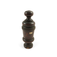Pepper mill. Dark wooden cylinder with turned bands, with a knob at the top.