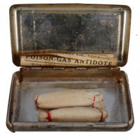 Image of early 20th century poison gas antidote in metal box.