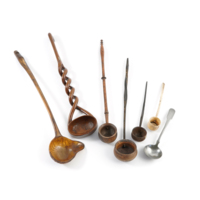 Toddy ladles. Left to right: ladle made of horn, wooden ladle with a double helix twisted handle, wooden ladle with a turned handle, two wooden ladles with twisted horn handles, a ladle made of bone, and a silver ladle.