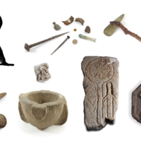 A large printed capital letter R with stone carvings, an axe, a bottle, a coin, a medal and some metal fragments.