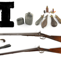 A large printed capital letter M with shotguns, flasks, cartridges and a pair of grouse.