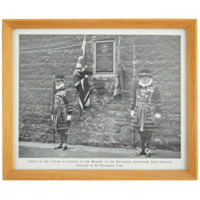 Photograph. A memorial plaque on a wall at the Tower of London with two guards. The photograph is captioned TABLET IN THE TOWER OF LONDON TO THE MEMORY OF THE REVEREND ALEXANDER JOHN FORSYTH, Inventor of the Percussion Lock.