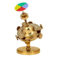 Dynamical top. A brass spinning top on a stand. The top has six knobs on its edge and three on its upper surface. On a rod projecting from the top is a paper disc divided into green, blue, red and yellow quarters.