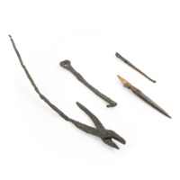 Iron objects from Coull Castle. Left to right: tongs with long handles, a large simple key or door catch with a ring on one end and a tooth at the other, a narrow single edged knife blade with a fragment of a wooden handle, and a long pointed arrowhead or skewer like object.