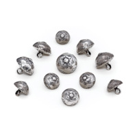 Buttons. 11 small, stud shaped silver buttons with roses engraved on them.