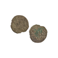 Penny. A small silver coin with a portrait of a man wearing a crown on one side, and a cross with three circles between each arm on the other. The edges of the coin are chipped and cracked.