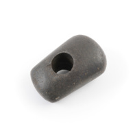 Mace head. A rounded rectangular block of black polished stone, with a perfectly circular hole about the size of a ten pence piece drilled through it near the centre.