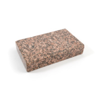 Block. A small rectangular block of pink and black speckled granite polished extremely smooth.