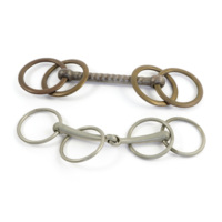 Snaffle bits. Two metal rods, one hinged in the middle, with a pair of rings on each end.