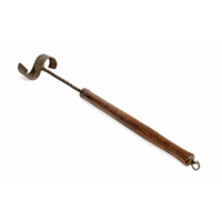 Kail gully. An iron tool with a thick wooden handle, about three feet long. The handle is round with a square end with a metal ring on it. The head of the tool consists of a twisted rod of iron with a wide S shaped projection on the end.