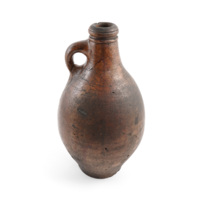 Flagon. A brown ceramic bottle about a foot tall with a fat body and a small handle at the neck.