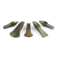 Flanged axe heads. Five bronze axe heads with flanges extending up and below from the sides perpendicular to the blade edge.