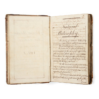 Notebook. An open manuscript book, on the first page titled Natural Philosophy. The text defines natural philosophy and begins describing a history of science from the ancients.