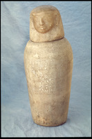 Canopic Jar. Jar with the human faced Mestha, or Imsety, depicted on the lid. Hieroglyphics are visible on the body of the jar.